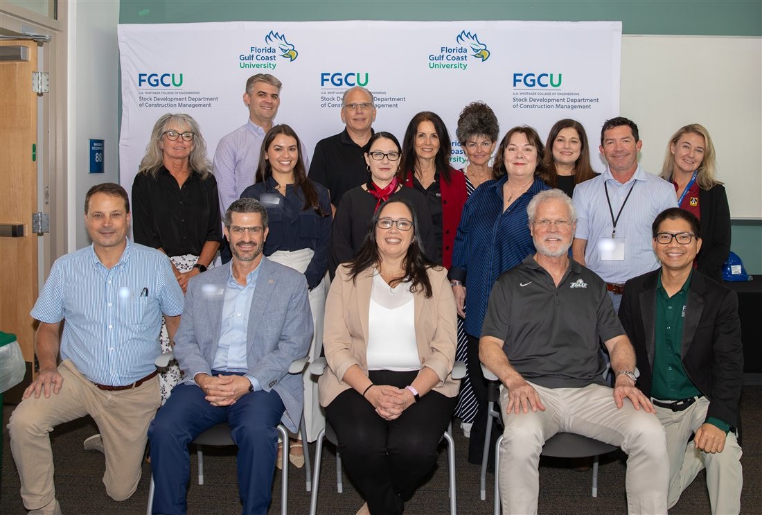 Dr. Nguyen with the FGCU construction community and industry partners; name tags obscured